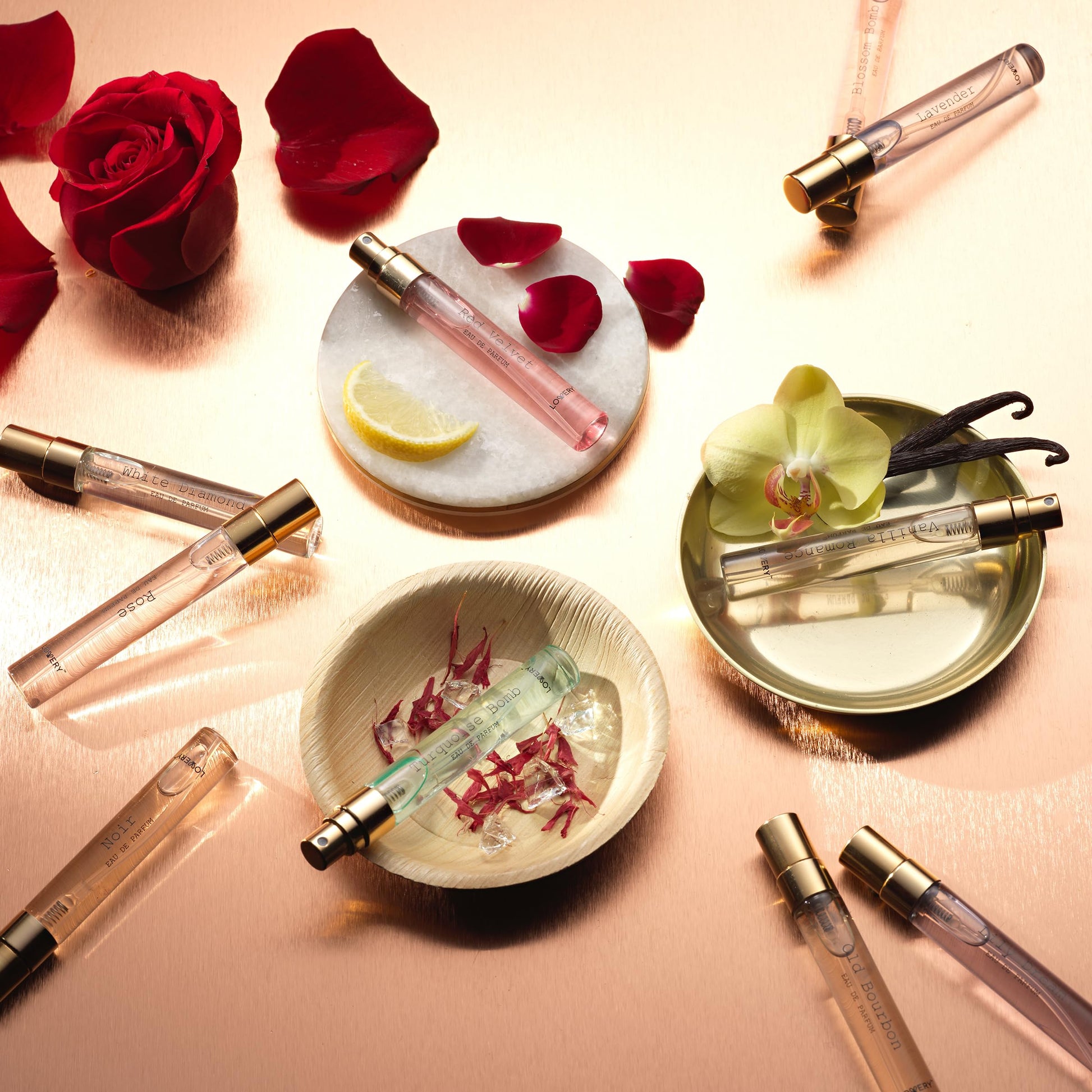 Lovery perfume discovery sampler set arranged neatly inside the premium gold toned gift packaging