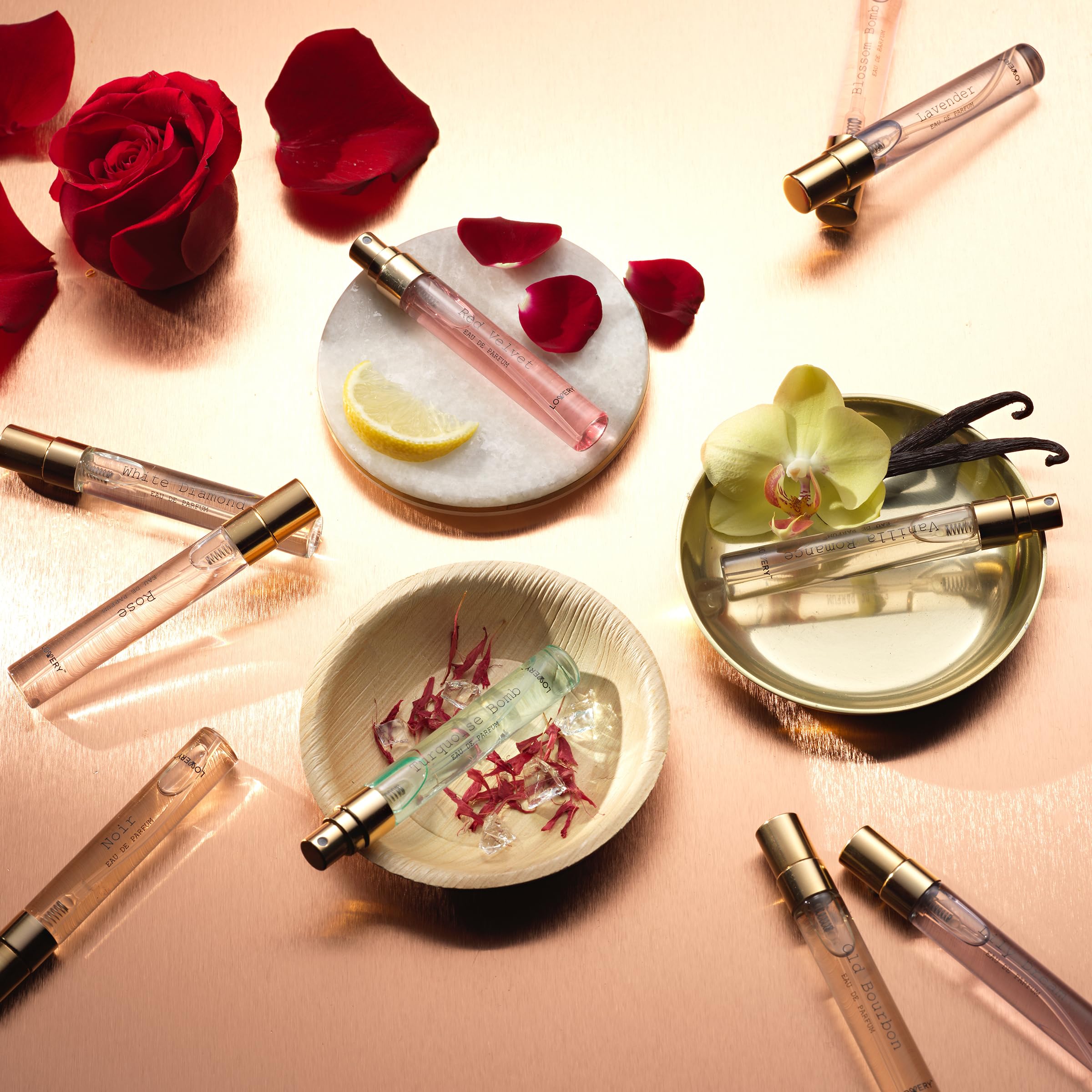 Lovery perfume discovery sampler set arranged neatly inside the premium gold toned gift packaging