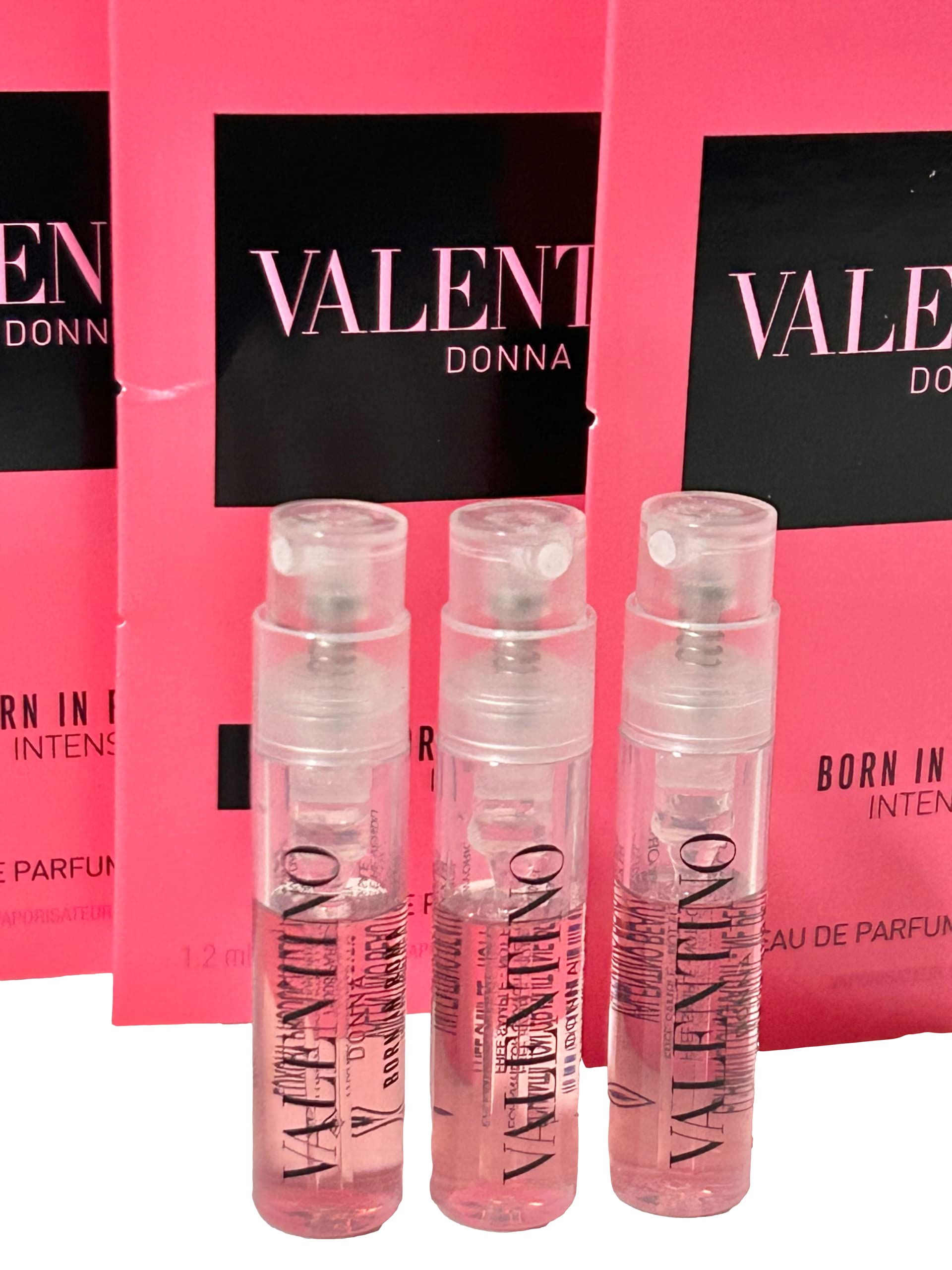 Three pieces of authentic imported Valentino Donna Born In Roma Intense spray miniatures displayed together.