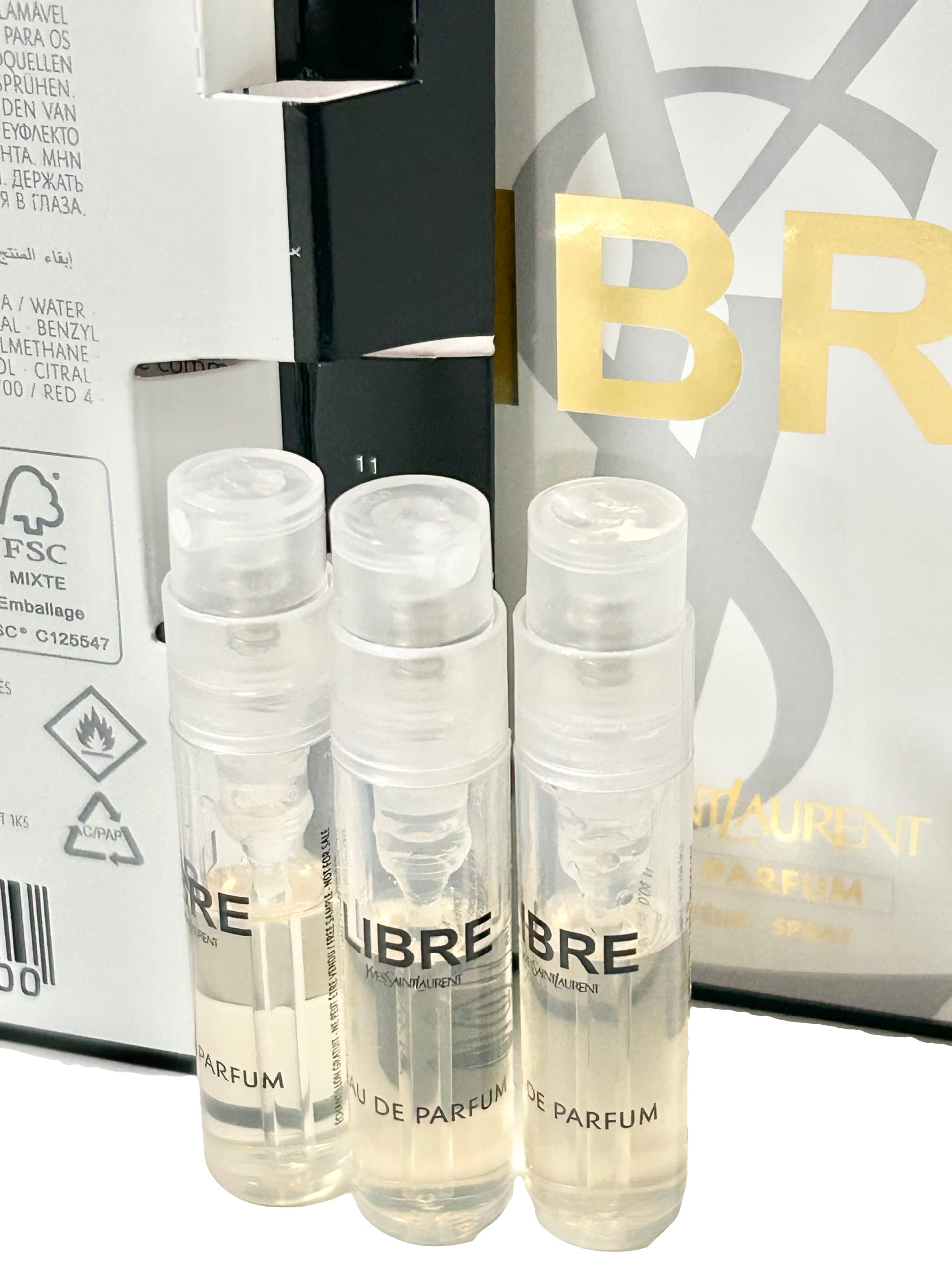 Three count luxury YSL Libre miniature perfume spray vials standing upright