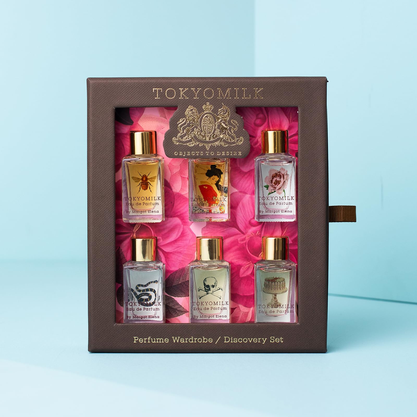Six miniature TokyoMilk Classic perfume dabber bottles displayed in a row
