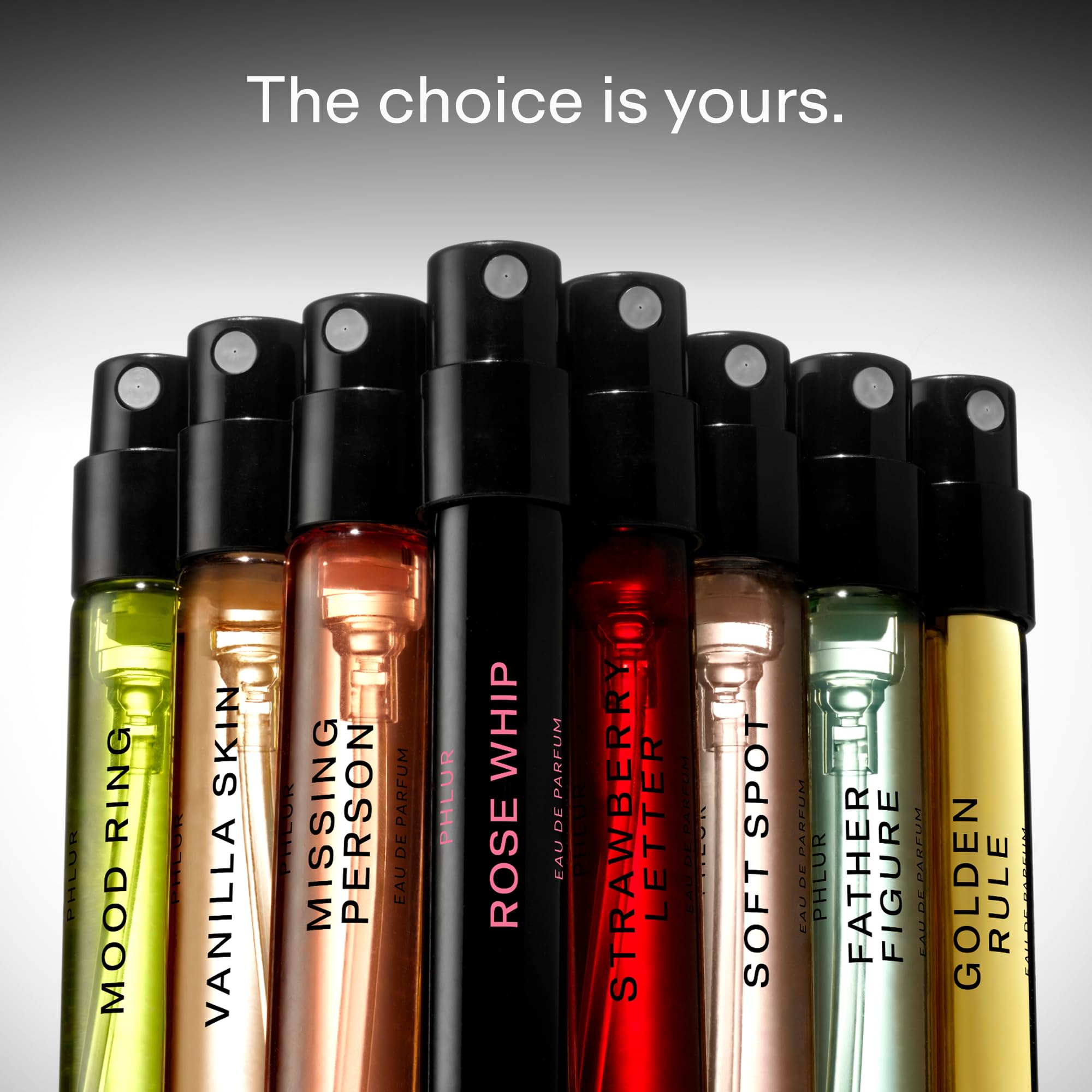 Phlur eight piece perfume sample collection spray vials neatly displayed