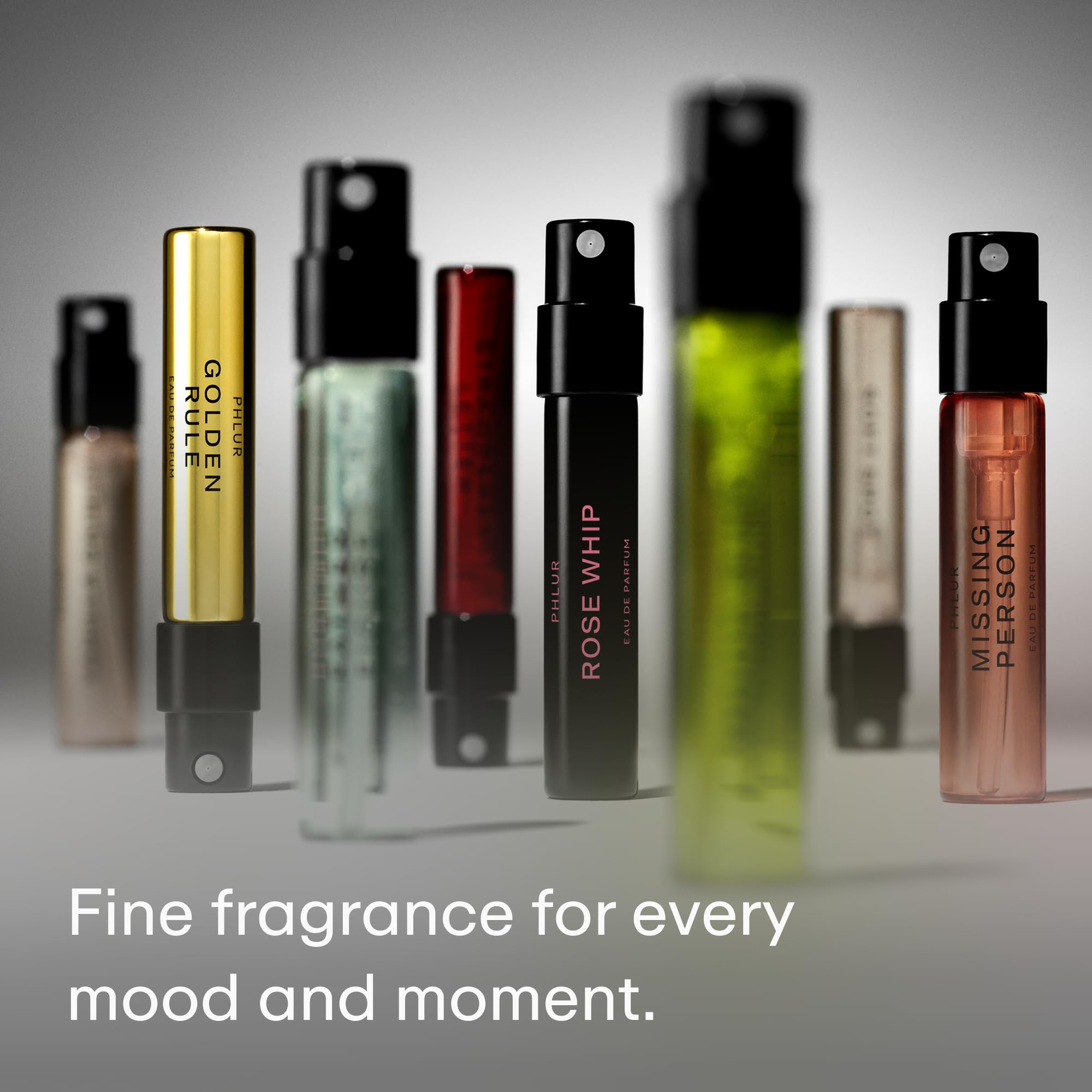 Phlur fine fragrance sample assortment unboxed view on a clean surface