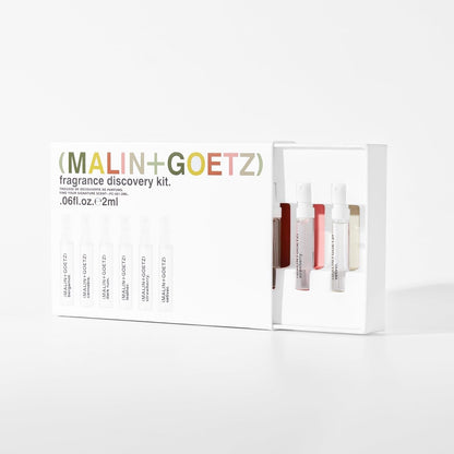 The six gender-neutral spray vials of the MALIN+GOETZ apothecary fragrance kit displayed out of their packaging box.