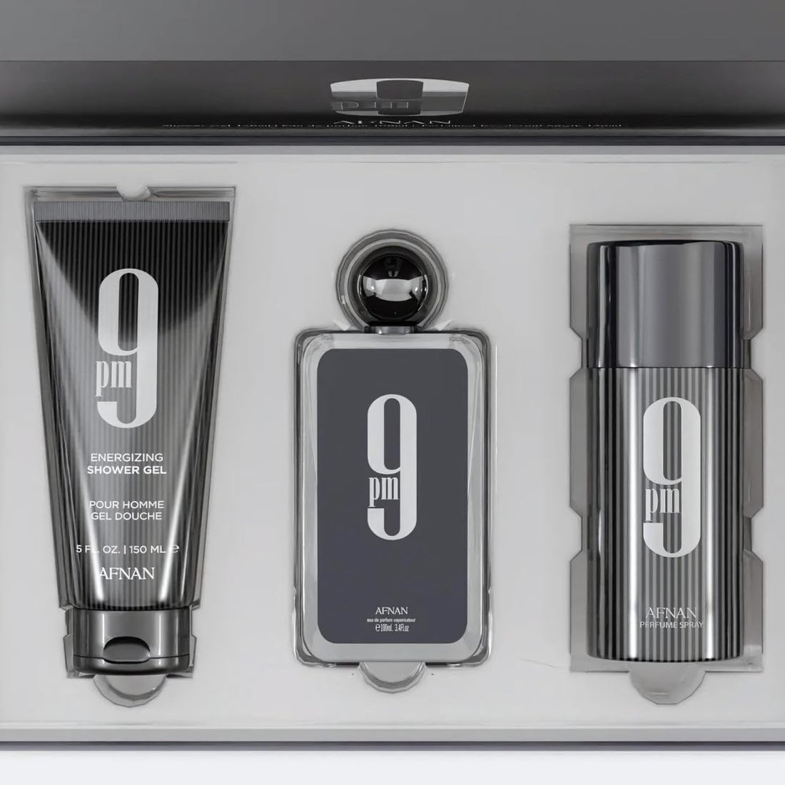 Afnan 9 PM Eau de Parfum bottle and grooming products
