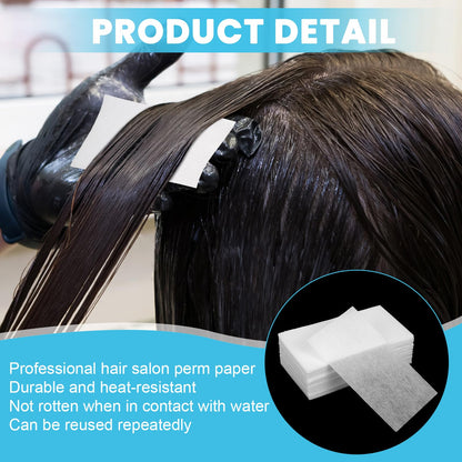 White rectangular absorbent curling papers spread out on a stylist table to show texture and durable quality.