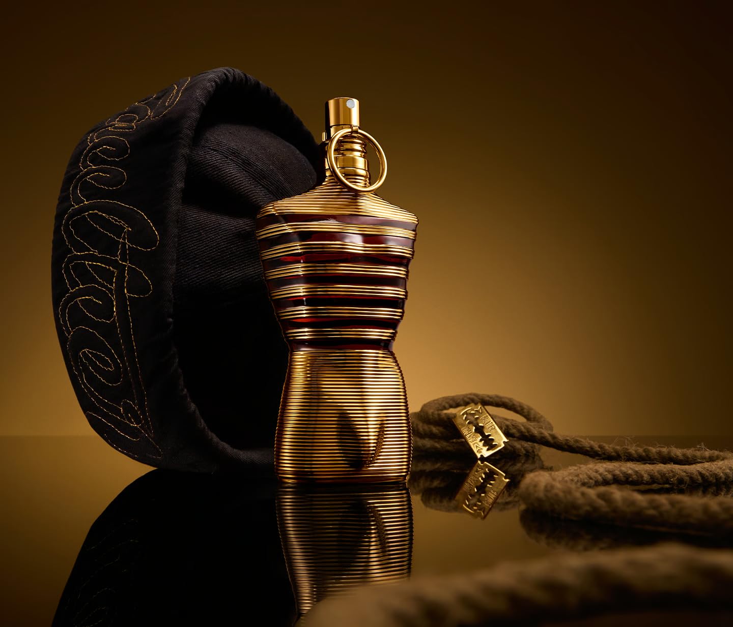 Jean Paul Gaultier Le Male Elixir Parfum spray bottle and shower gel packaging