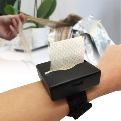 Professional hair curling tissues laid out next to the sleek black plastic storage accessory
