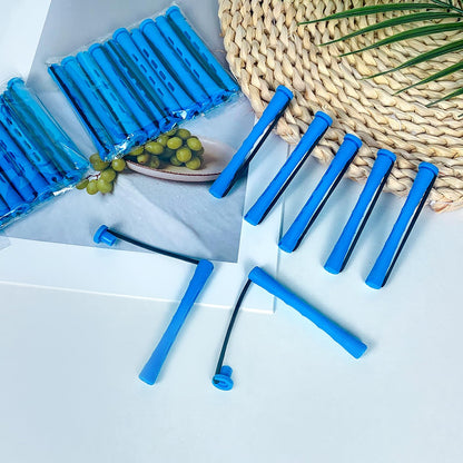 Professional hairdressing tools including blue cold wave perming rods.