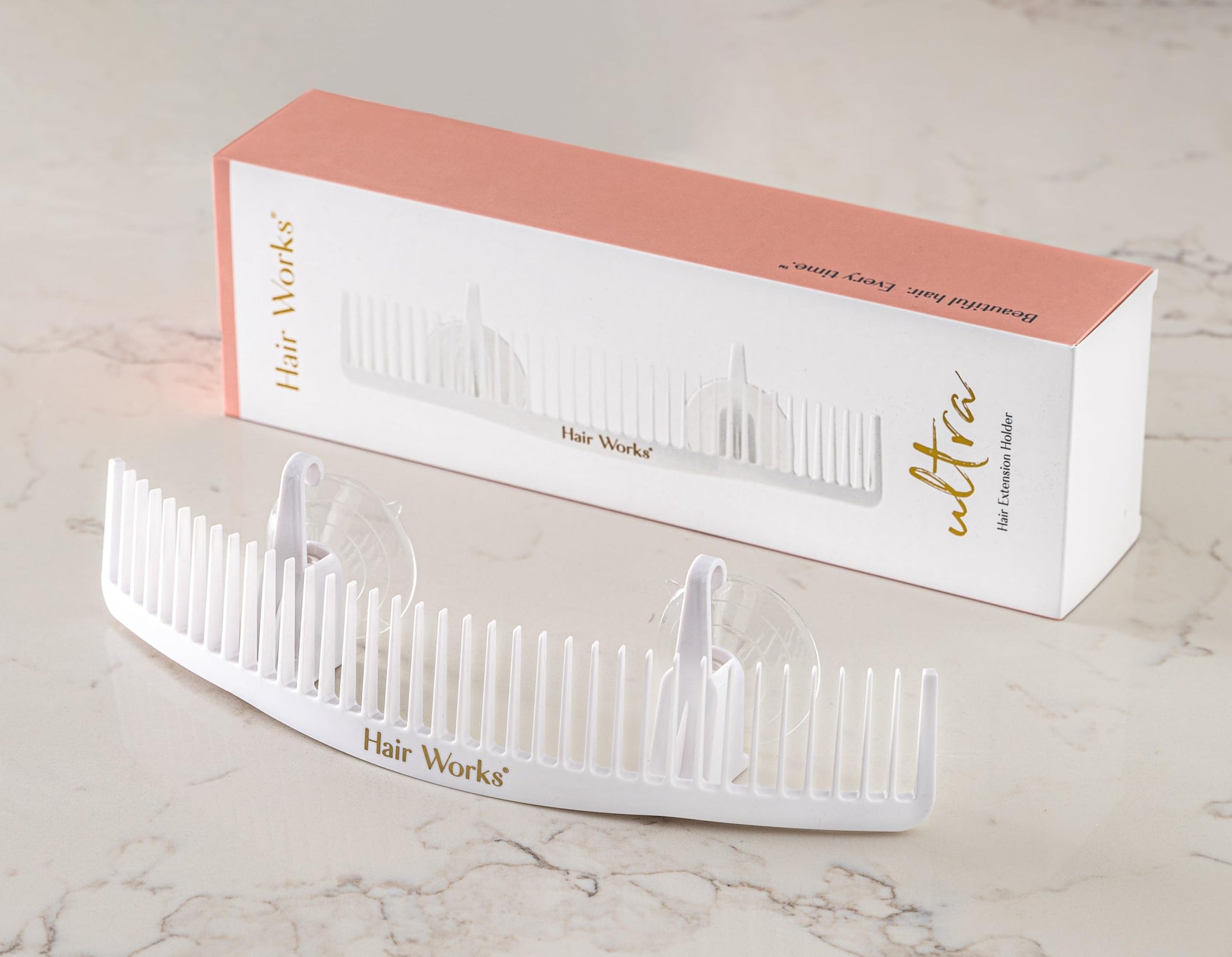 White Hair Works extension holder with suction cups attached to wall