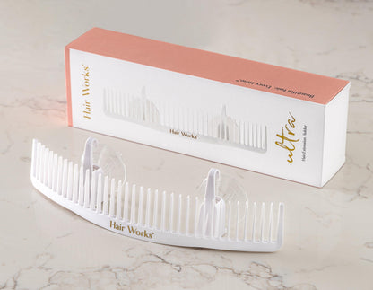 White Hair Works extension holder with suction cups attached to wall