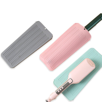 Flexible UORNERI silicone travel pouch being folded for compact luggage storage