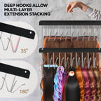 Close up of nine deep stainless steel hooks holding premium wefts