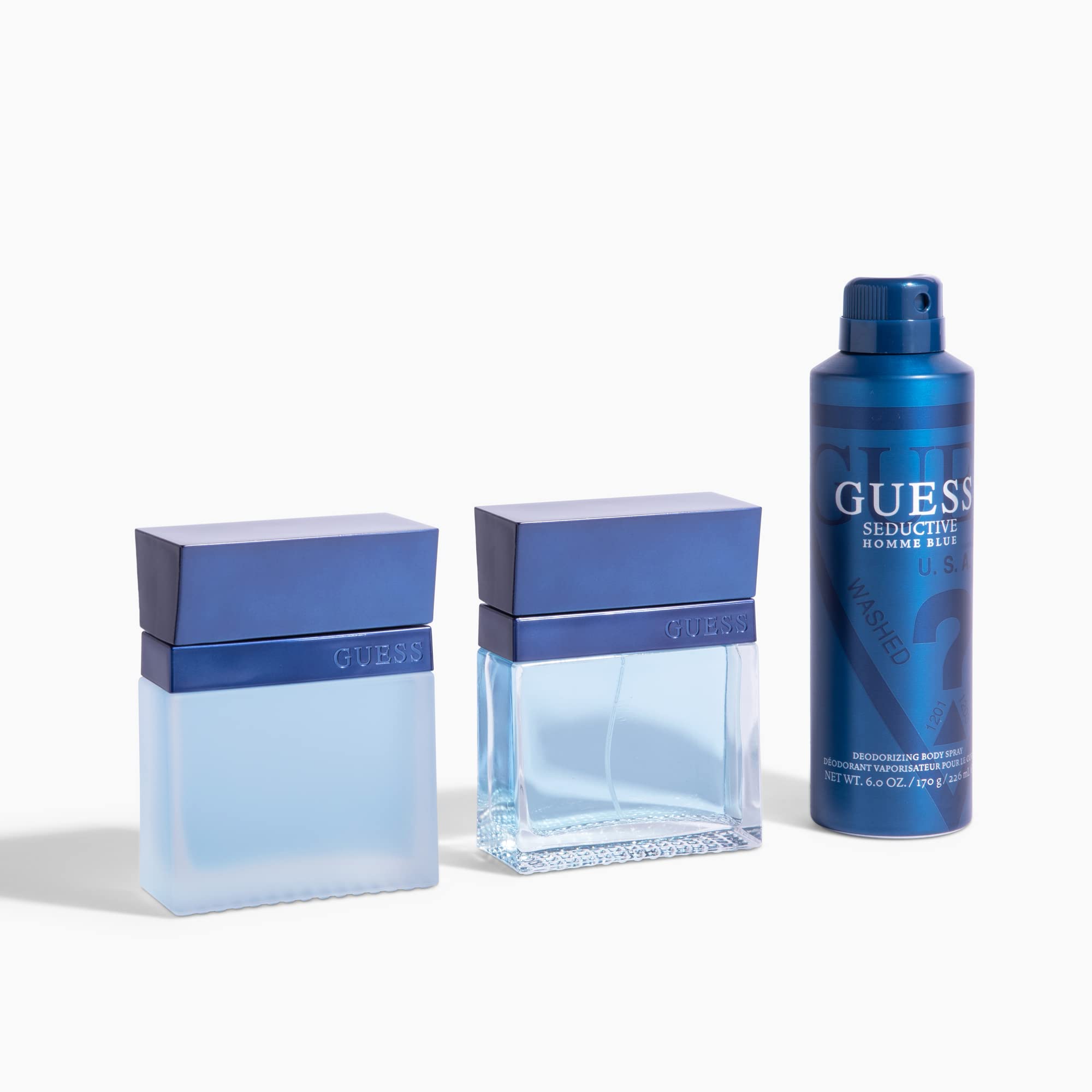 Authentic Guess Seductive Homme Blue Men Body Spray can standing upright highlighting the metallic blue grooming theme