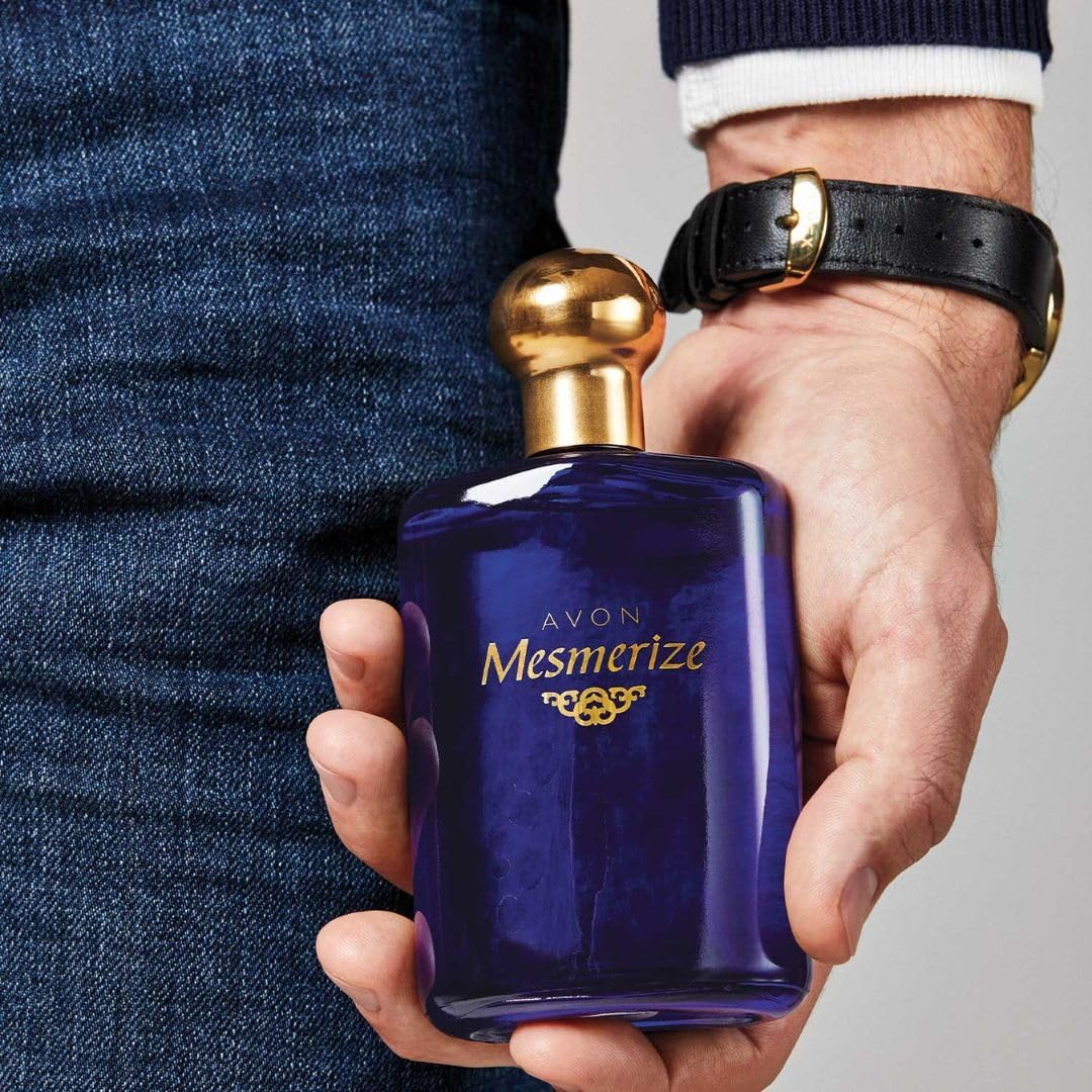 Avon Mesmerize cologne bottle side profile displaying the sleek elegant glass design