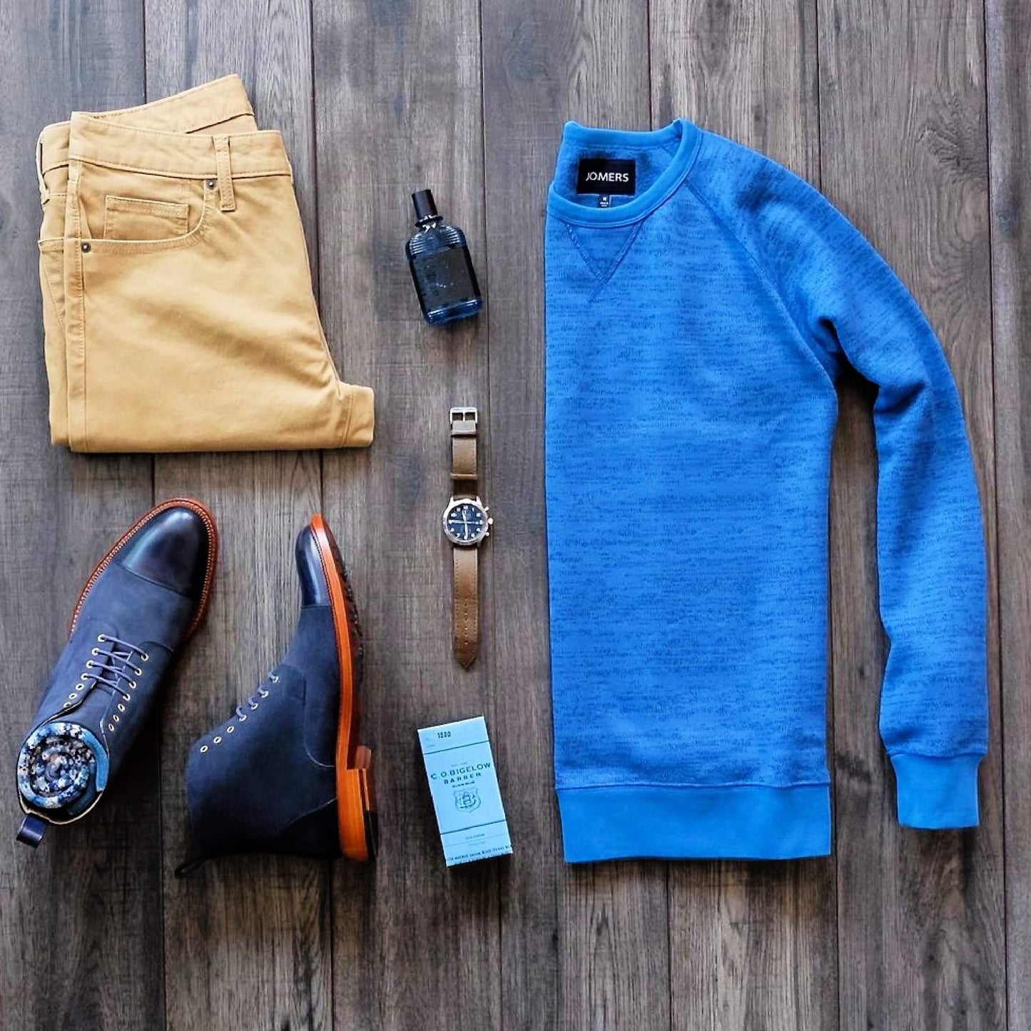 C.O. Bigelow Elixir Blue bottle held in hand