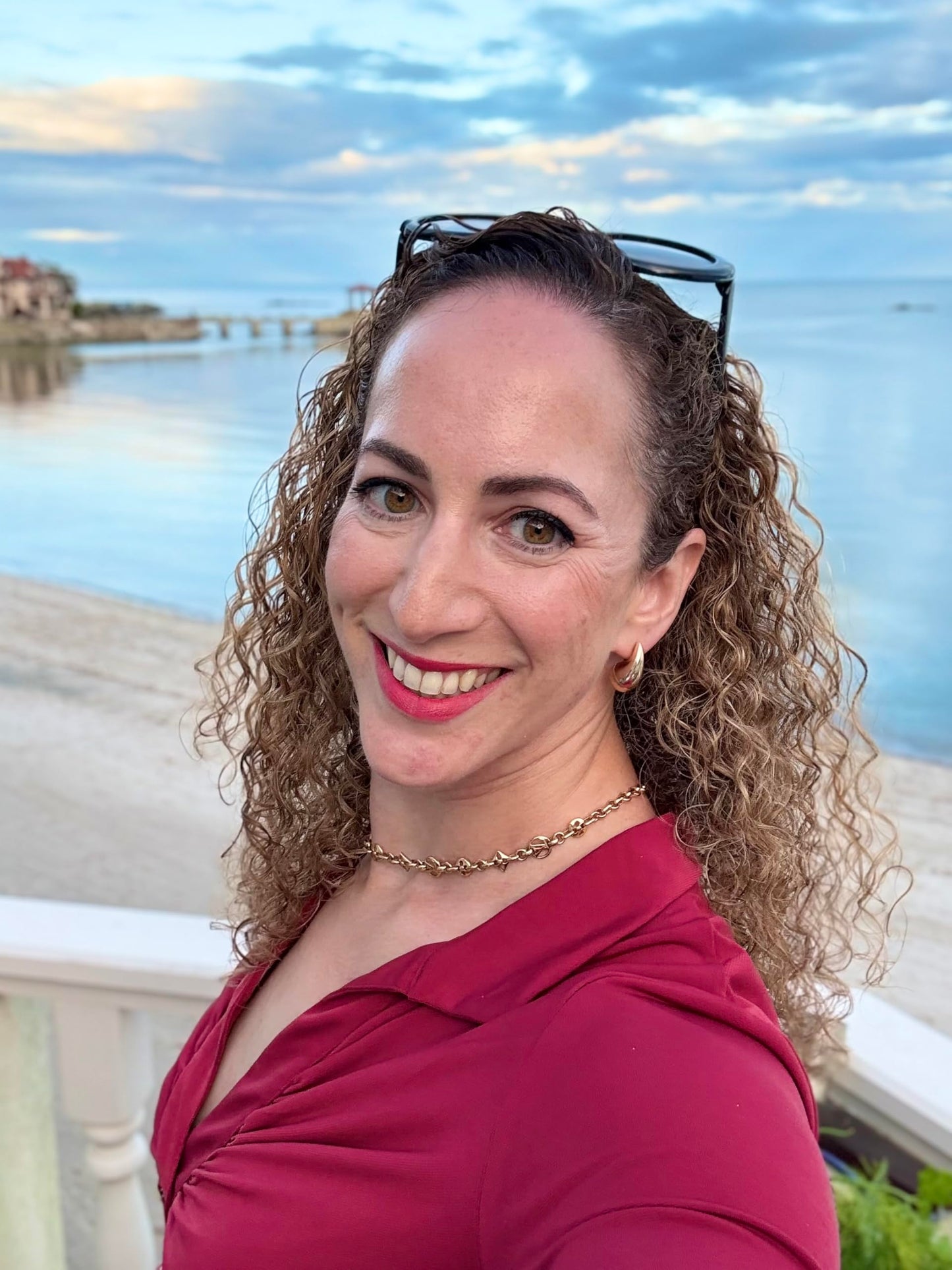 Professional curly hair styling results using Rebel Queen spray