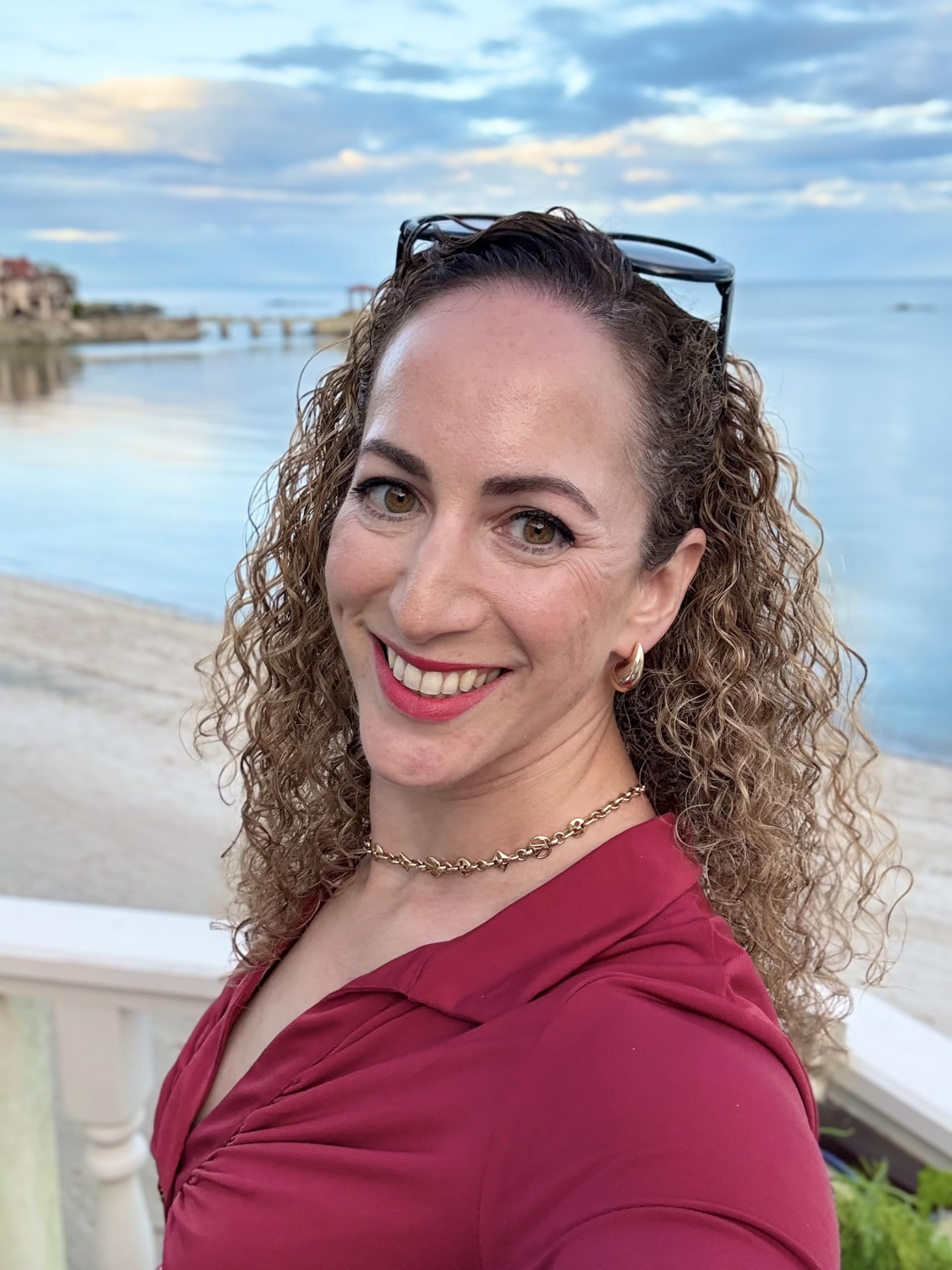 Professional curly hair styling results using Rebel Queen spray
