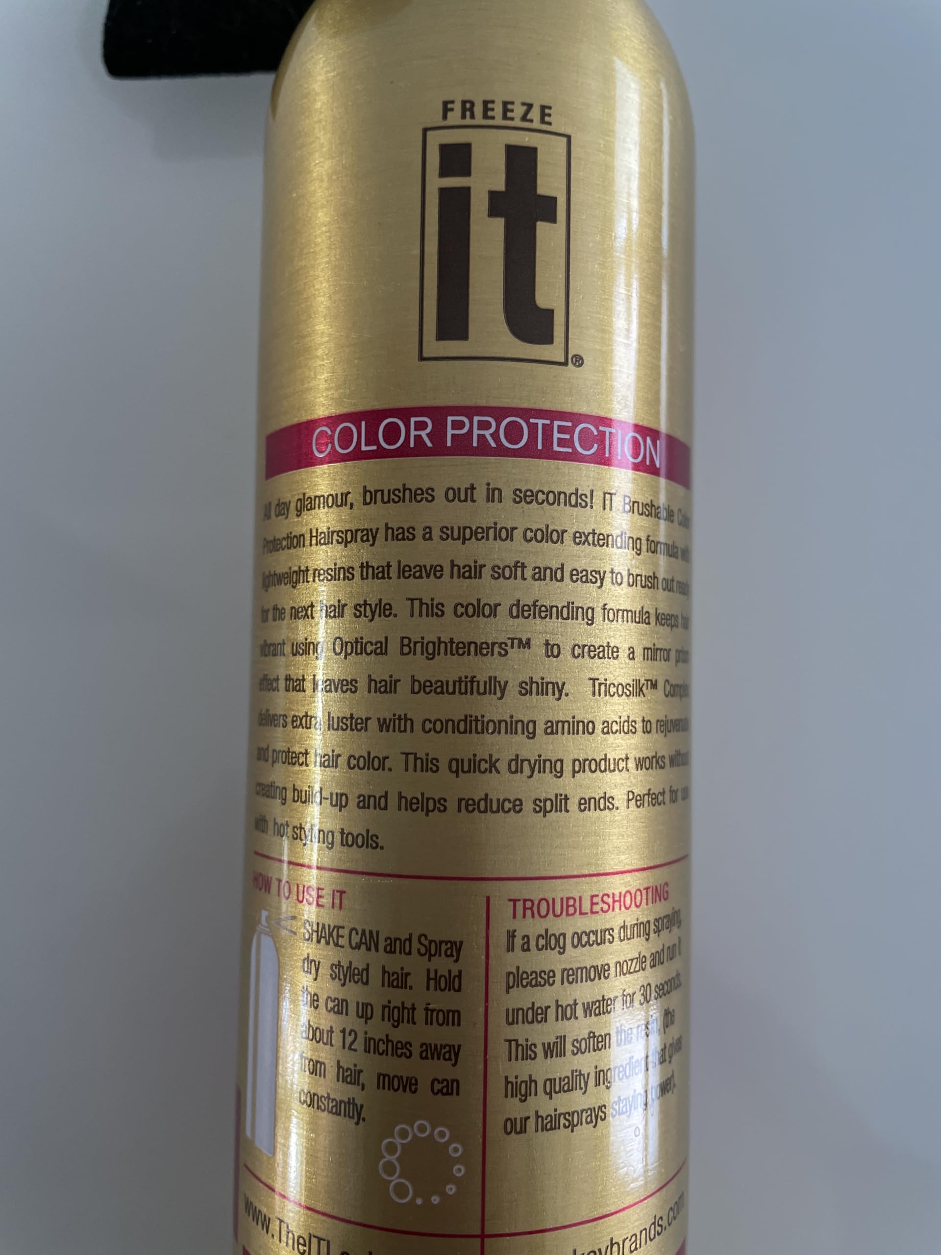 It Haircare Freeze brushable styling spray with Tricosilk for color preservation.