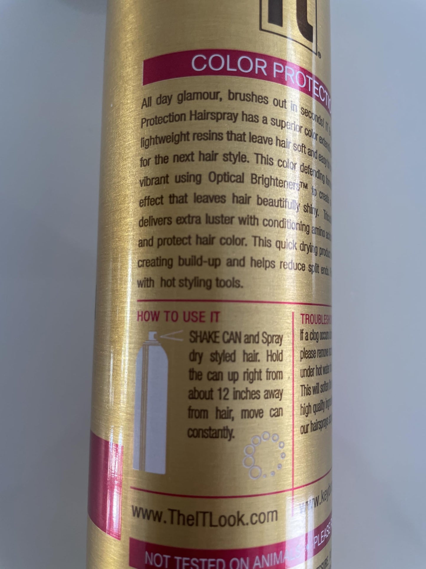 Back label of It Haircare Freeze salon styling spray displaying usage directions.