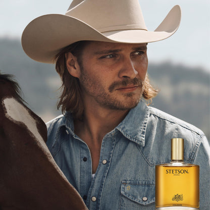 Stetson Original 1.5 Fluid Ounce bottle held to demonstrate its convenient travel size and premium glass design