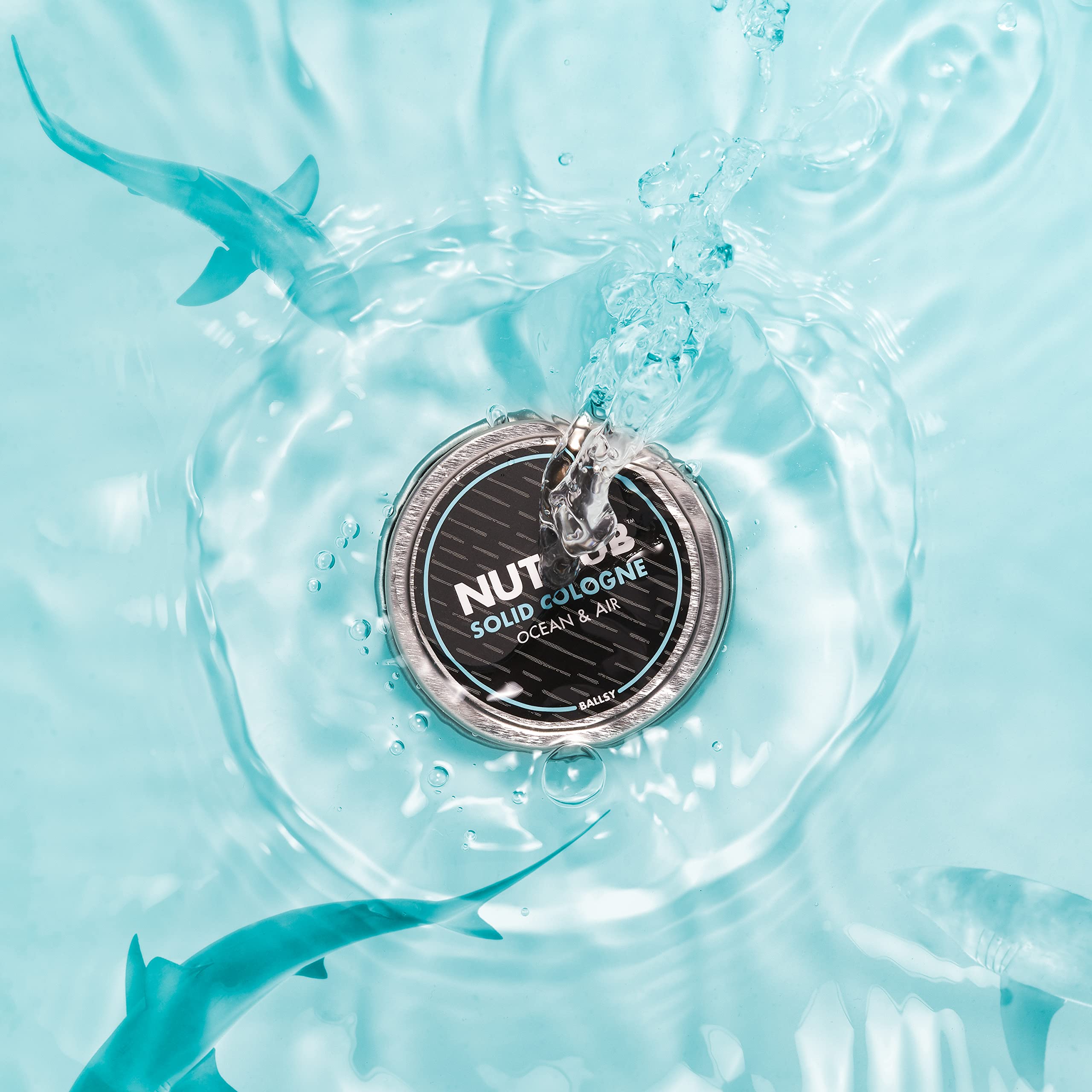 Open tin of Ballsy solid cologne showing wax balm texture