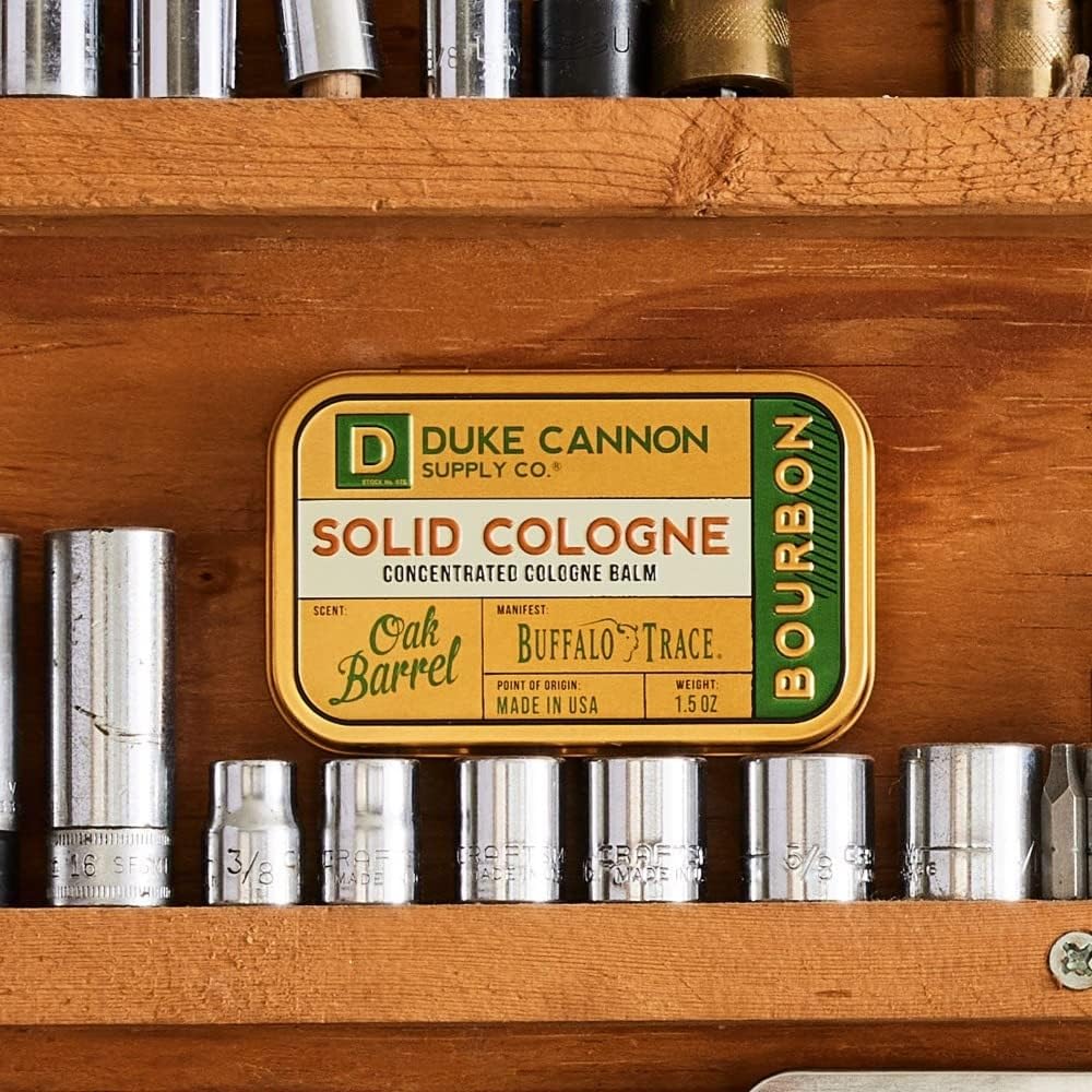 Duke Cannon solid cologne open tin showing concentrated balm