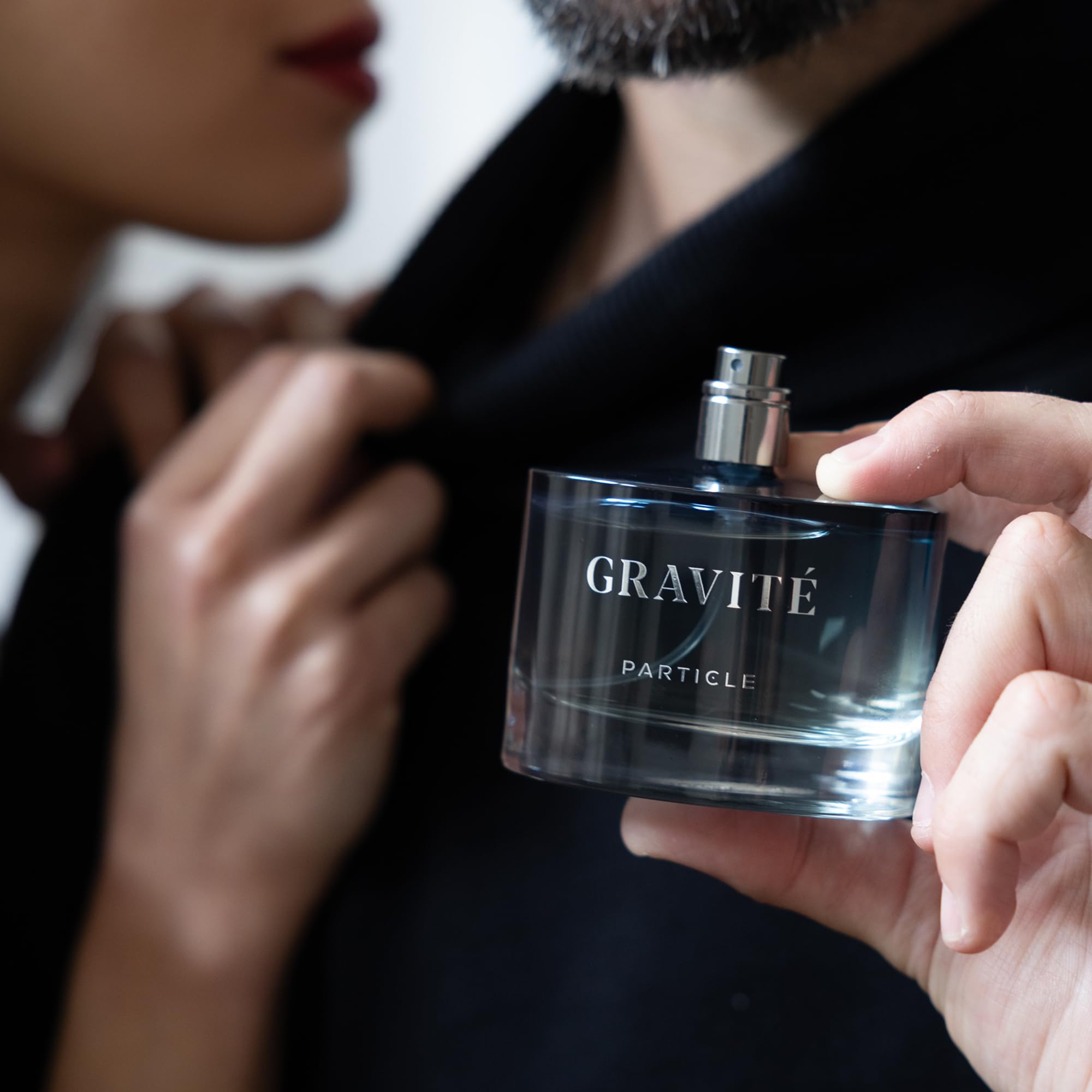 Particle Gravité cologne being applied to pulse points