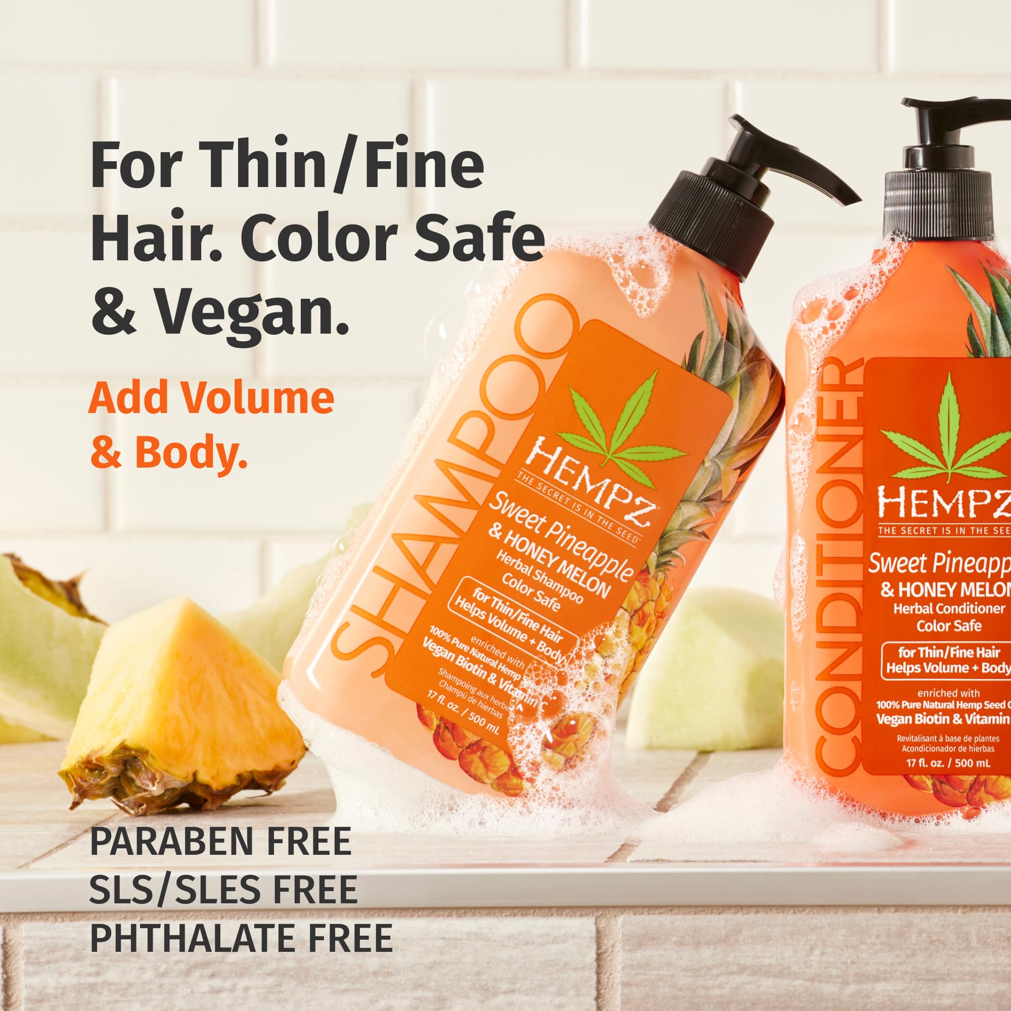 Close up of Hempz biotin shampoo label with pineapple and melon graphics