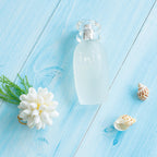 Luxury unisex ocean cologne spray standing upright alongside its clean white presentation box.