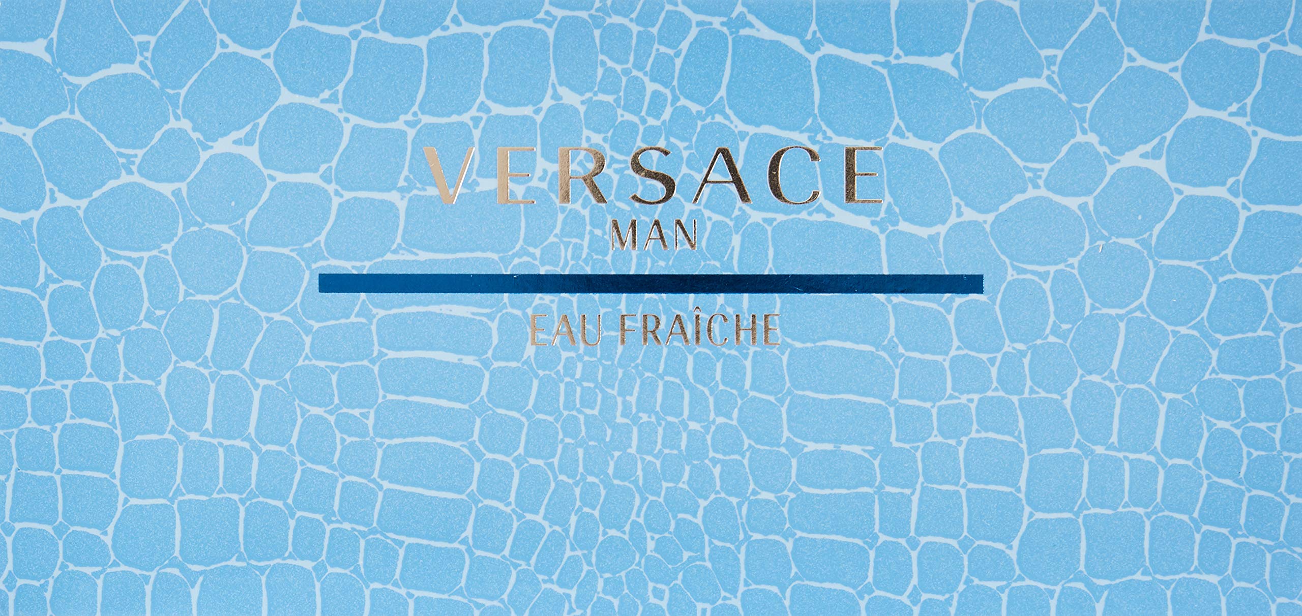 Close up shot of the Versace miniature Eau De Toilette splash bottle next to the blue luxury presentation box.