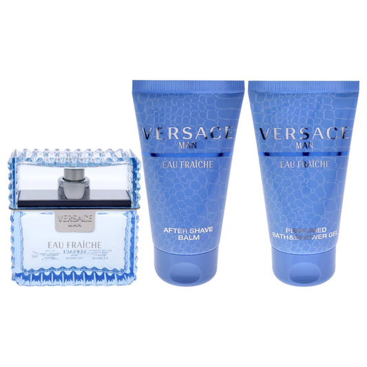 Authentic Versace three piece gift set items displayed out of packaging including cologne spray and grooming tubes