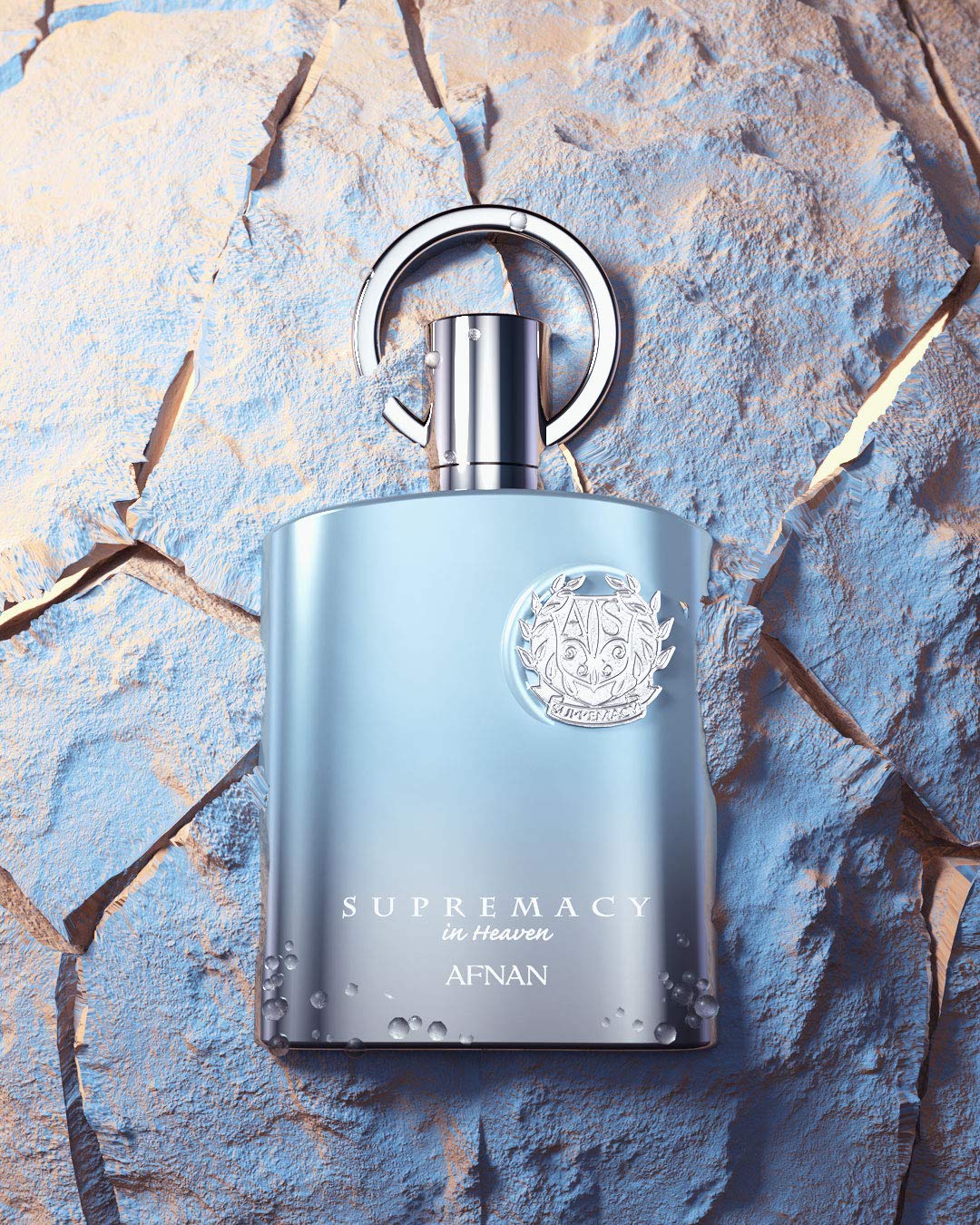 Close up shot of the metallic silver cap and intricate detailing on the Afnan Supremacy In Heaven bottle.