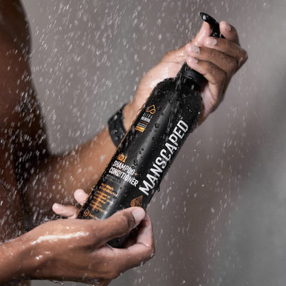 Manscaped shampoo and conditioner bottle in a modern bathroom setting