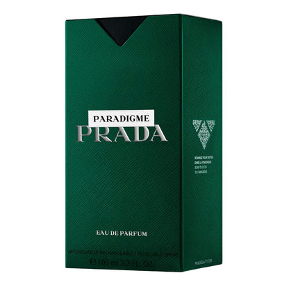Prada Paradigme Eau De Parfum green glass bottle with silver cap resting on premium backdrop