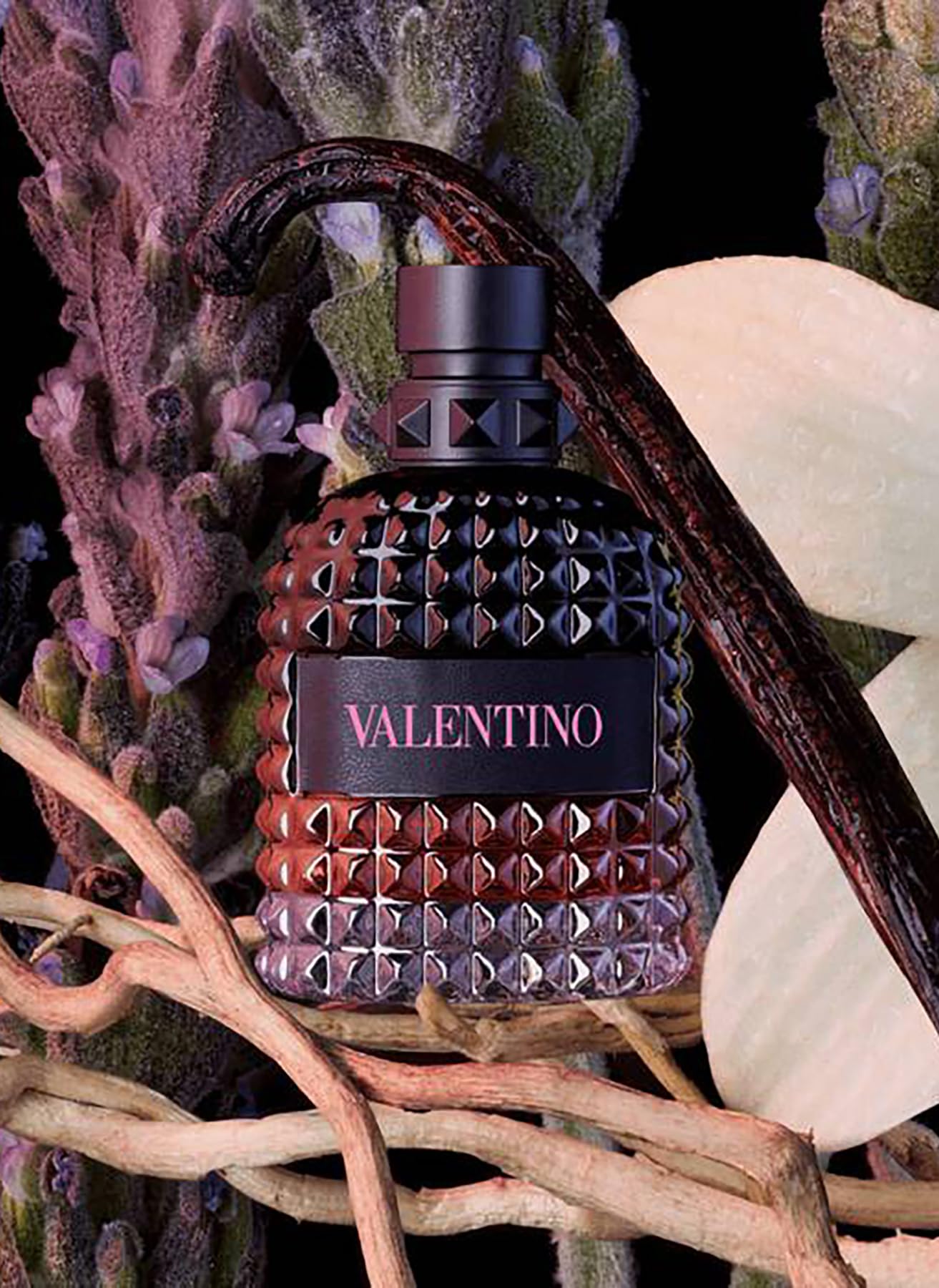 Side angle view of Valentino Uomo Born In Roma Intense for men 3.4 ounce showing the textured black studded cap.