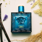 Close up view of the spray nozzle and gold accented cap of the Versace Eros luxury perfume