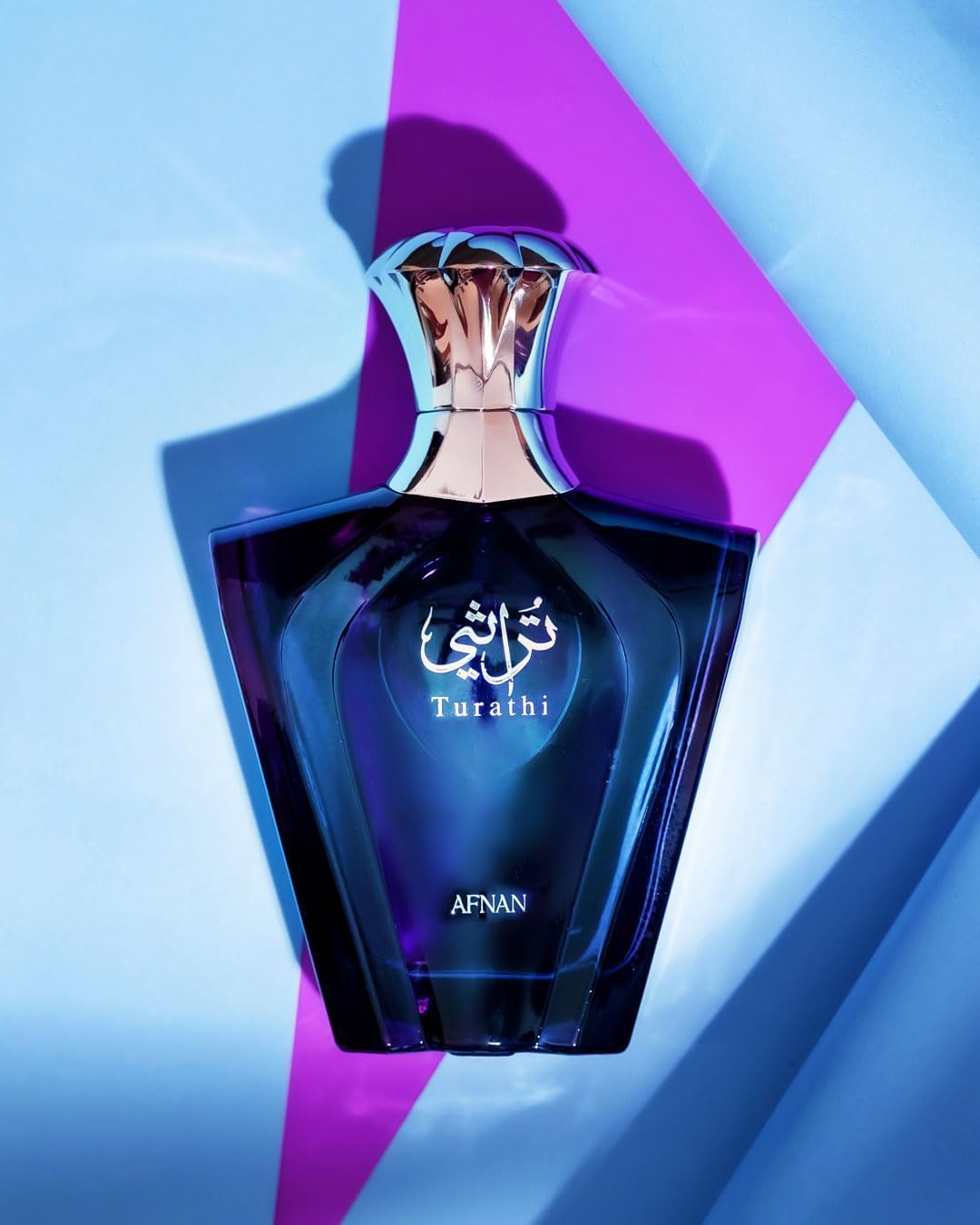 Side profile of the elegant blue and silver Afnan Turathi perfume bottle