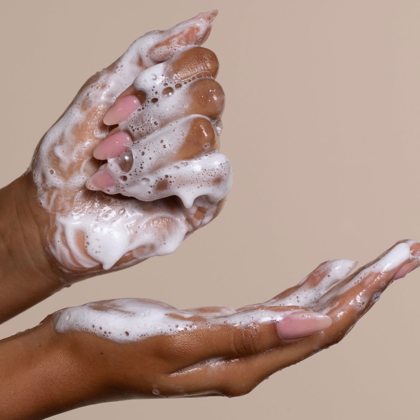 Cantu sulfate free cream shampoo texture alongside the product bottle packaging