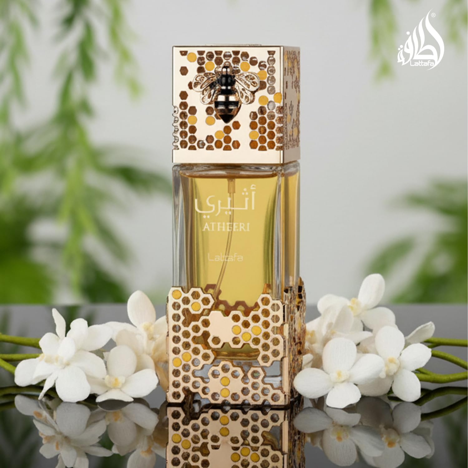 Close up view of the intricate honeycomb outer cage decoration on the Lattafa Atheeri perfume bottle