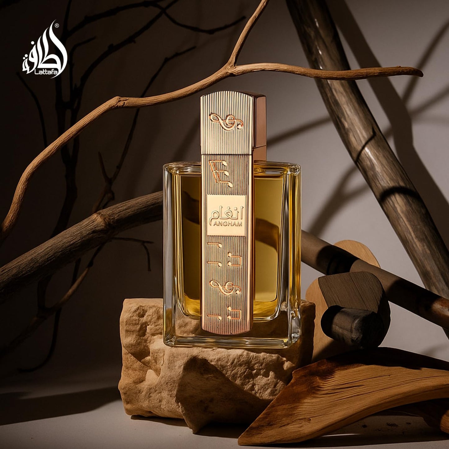 Authentic Lattafa Angham perfume bottle standing upright next to its official imported product packaging.