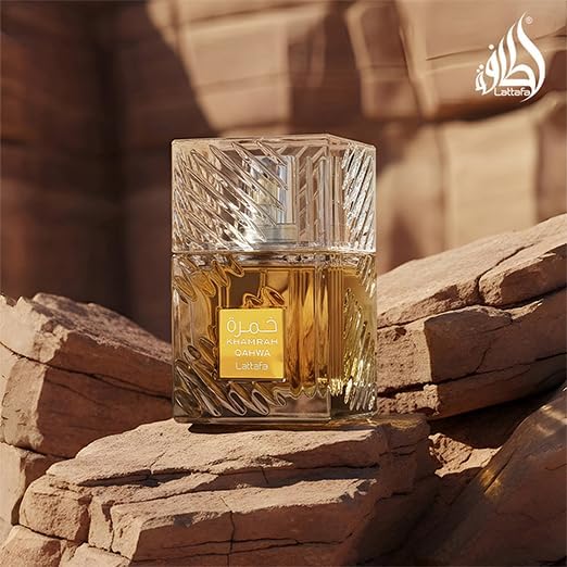 Lattafa Khamrah Qahwa gourmand fragrance ingredients visualization including coffee beans, cinnamon sticks, and vanilla pods.
