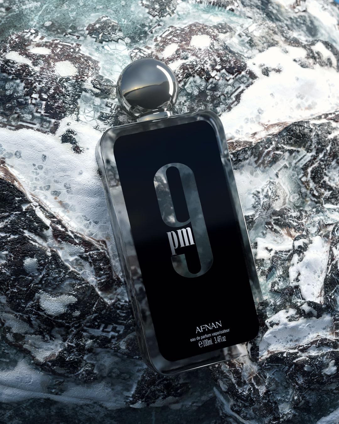 Premium presentation of Afnan 9 PM luxury amber vanilla fragrance for men.