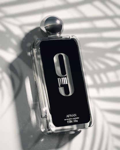 Side view of Afnan 9 PM Edition bottle emphasizing its elegant minimalist design.