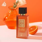 Authentic USA imported Lattafa Ana Abiyedh Coral bottle next to its retail display box.