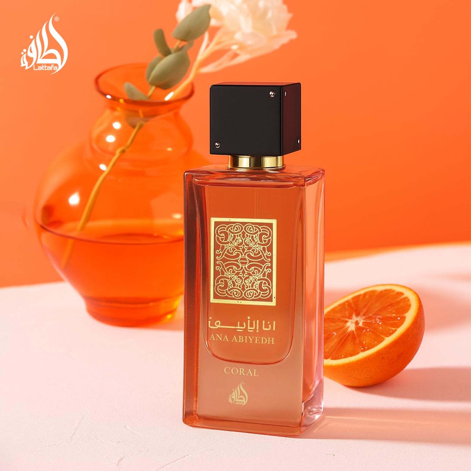 Authentic USA imported Lattafa Ana Abiyedh Coral bottle next to its retail display box.