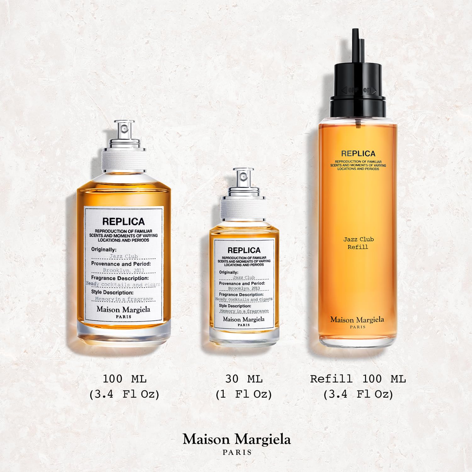 Maison Margiela luxury fragrance bottle highlighting the amber colored liquid