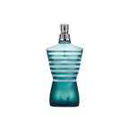 Authentic Jean Paul Gaultier Le Male men's fragrance standing next to its signature metal canister packaging.