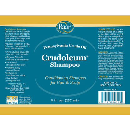 Baar Crudoleum shampoo bottle held in hand for scale