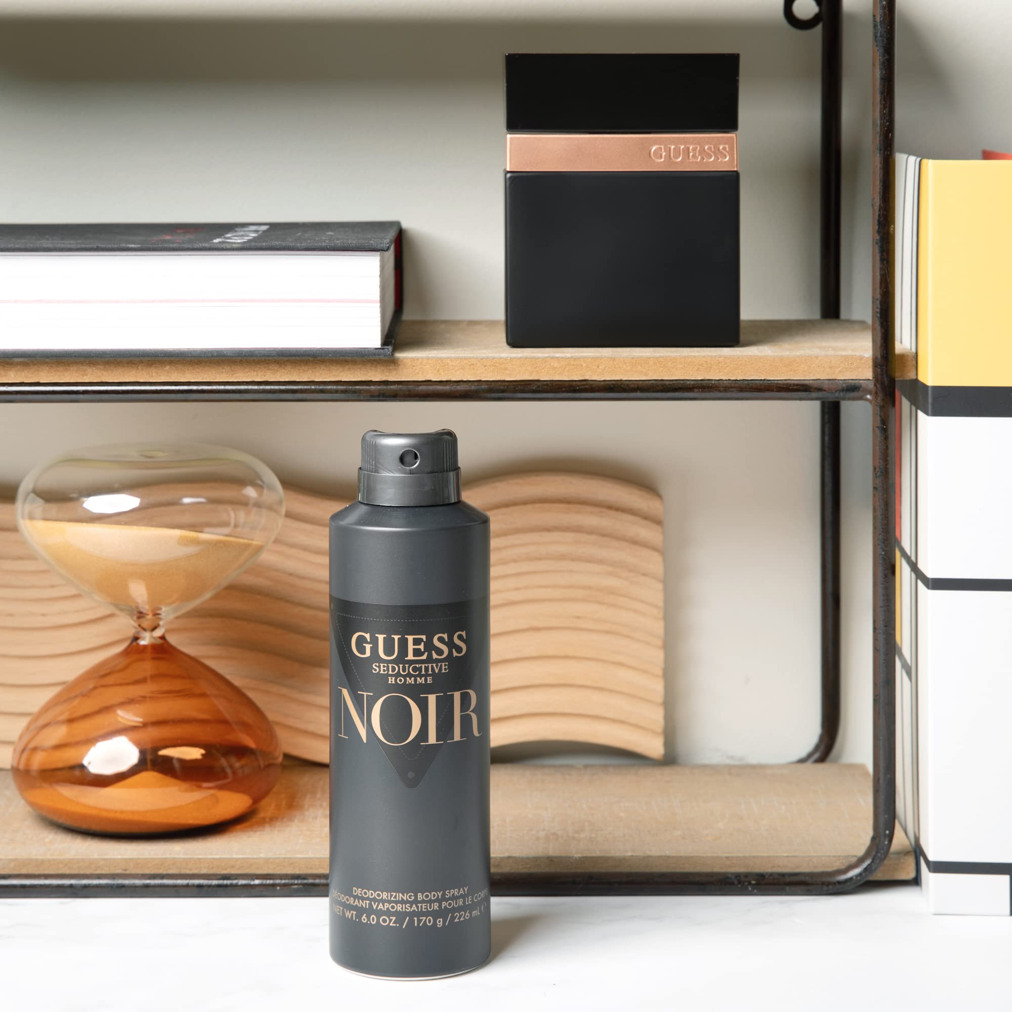 Side angle of the GUESS Seductive Noir for Men fragrance highlighting the clear brand engraving.